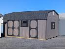 12x20 Dutch Series shed in driftwood polyurethane stain with black trim and black shingles